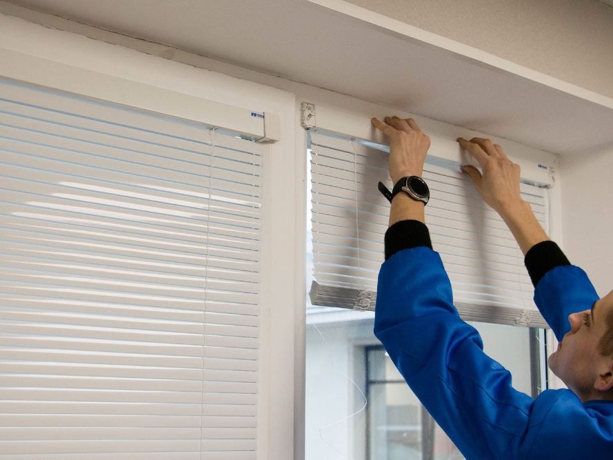 Blinds Curtains Outlet design consultant measuring a window for custom blinds in Sydney